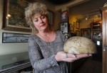 Curator Jan Collins holds the proverbial eggshell skull