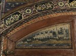 A wood-panelled section of the painted walls in the iwan