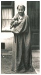Gustav Klimt with kitty in front of the entrance to his second-to-last studio