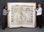 Klencke Atlas with British Library curators for scale. Image courtesy the British Library.