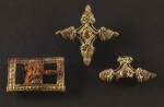 Two cross-shaped fittings and a rectangular buckle. Photo courtesy the Museum of Skanderborg.