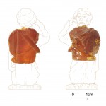 Amber carving with drawing of complete figure. Photo © Northern Archaeological Associates.