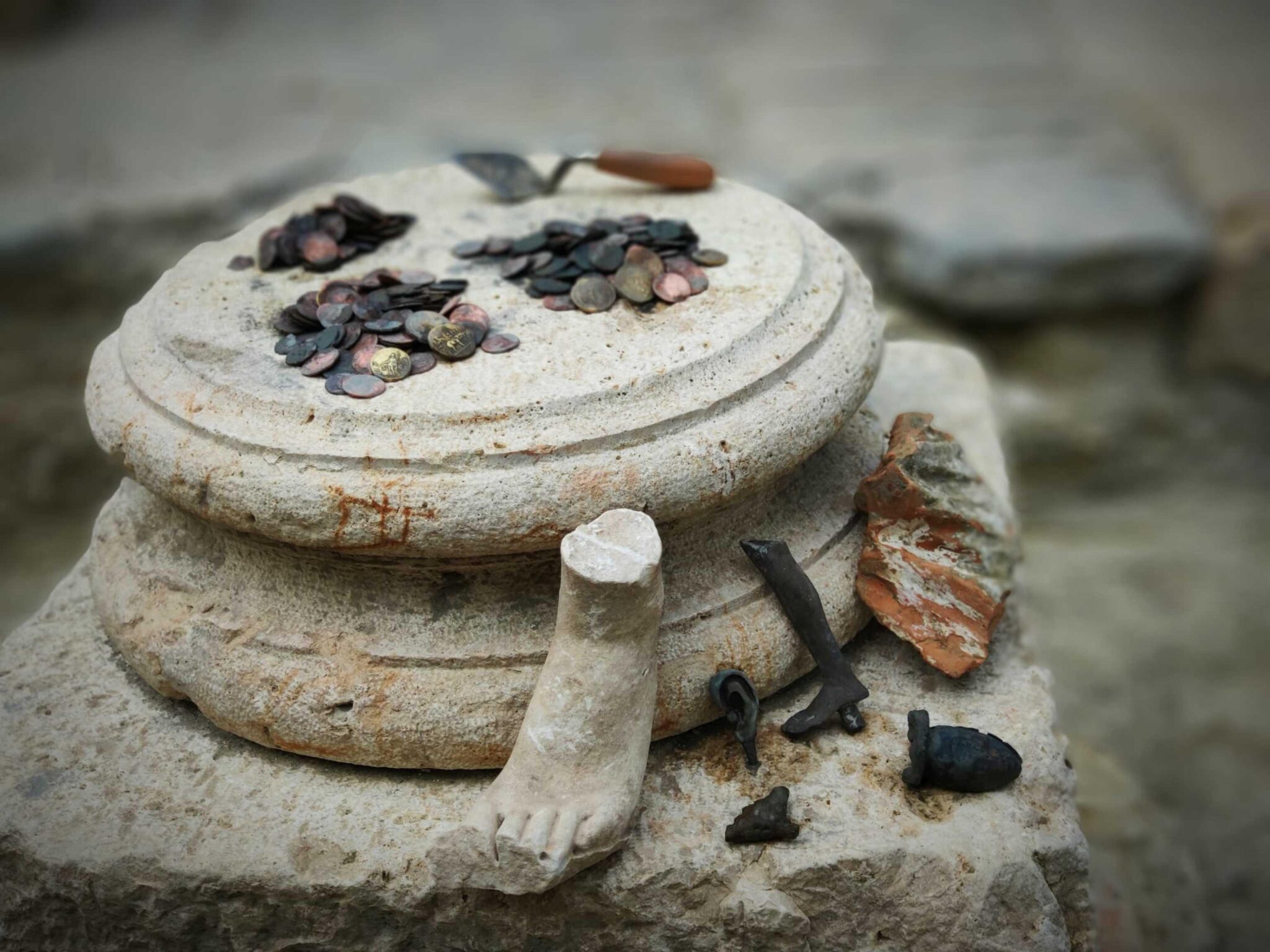Bronze uterus, mint coins found at sacred baths
