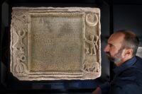 Dr Samuel Gartland with inscribed stone from the early 3rd century A.D. Photo by Simon Hulme.