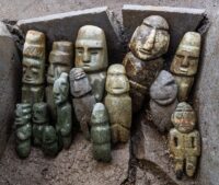 Fifteen Mezcala-style anthropomorphic figures. Photograph by Mirsa Islas, Courtesy of the Templo Mayor Project.