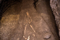 Skeletal remains in prone position inside the grave. Photo courtesy National Directorate of Cultural Heritage.