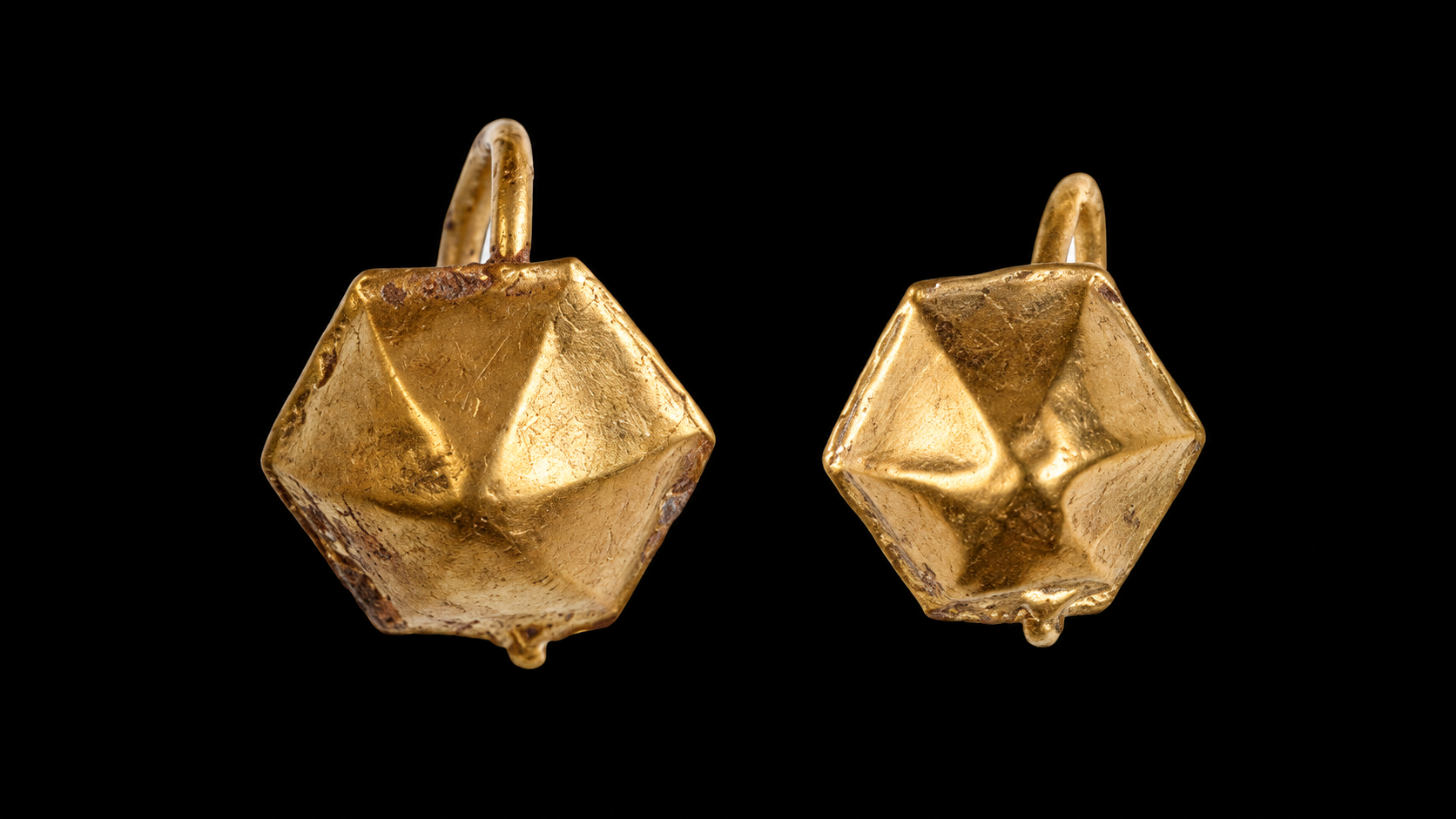 Pair of gold polyhedral earrings found in 3rd c. child's grave in Bulgaria. Photo courtesy Regional History Museum.